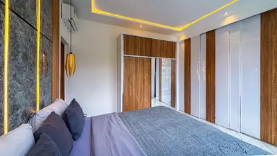 a bedroom with a bed and a large window at Seminyak Loft 360 Private Pool Villas in Seminyak