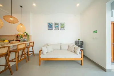 a living room with a couch and a table at Modern and Quiet 2BR Villa in Seminyak Central with Private Pool in Denpasar