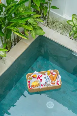 a tray of food sitting in a swimming pool at Modern and Quiet 2BR Villa in Seminyak Central with Private Pool in Denpasar