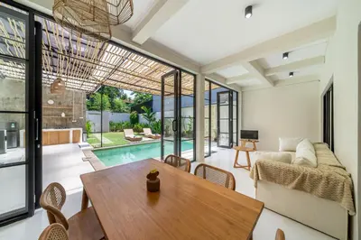 a living room with a table and a couch at Villa Ocean Bali in Seminyak