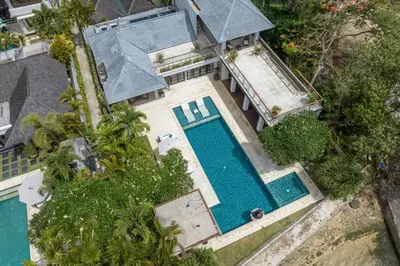 an overhead view of a house with a swimming pool at Beachfront Escape Villa in Ujung