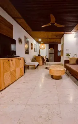 a large living room with a couch and a tv at Villa Wild in Seminyak