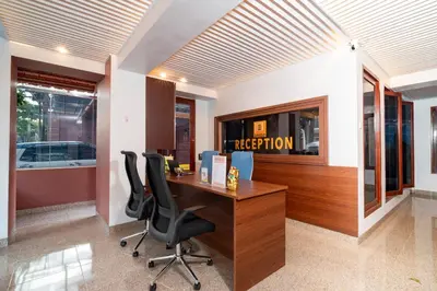 an office with a desk and two chairs at Hotel Dakozi Living in Kuta