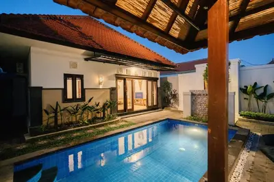 a swimming pool in the backyard of a house at Villa Kirari in Seminyak