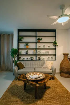 a living room with a couch and a coffee table at Amshiga 2 in Jimbaran