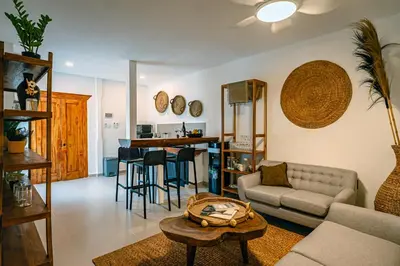 a living room with a couch and a table at Amshiga 6 in Jimbaran