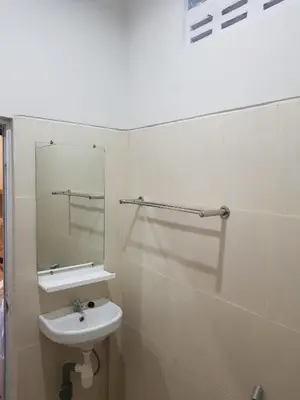 a bathroom with a sink and a mirror at Studio with rice field view in Kerobokan in Kerobokan