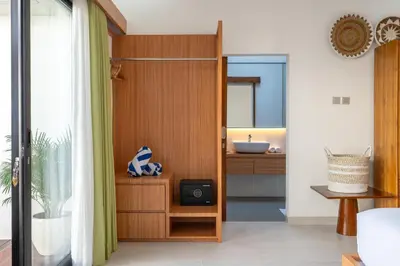a bathroom with a sink and a mirror at Nirvana Villa by Betterplace in Seminyak