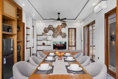 a dining room with a table and chairs at deTasia Villa by Kozystay - Jimbaran in Jimbaran