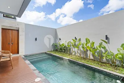 a swimming pool in the backyard of a house at deTasia Villa by Kozystay - Jimbaran in Jimbaran