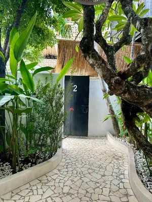 a door with the number two in front of a building at Villa Vela in the heart of Seminyak in Seminyak