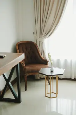 a living room with a couch and a table at The Visala Boutique Suites Seminyak in Seminyak