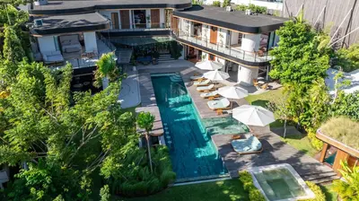 an aerial view of a house with a swimming pool at Dreamtime House Bali in Canggu