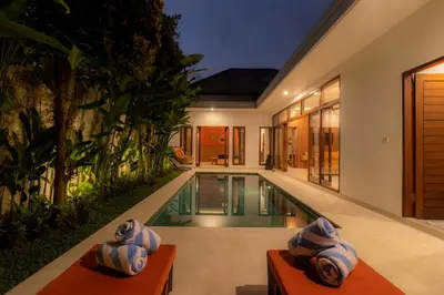 an external view of a villa with a swimming pool at Villa Suka Damai Peaceful 2 Bedroom Getaway in Seminyak