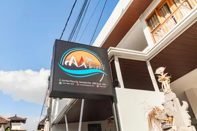 a sign on the side of a building at AA Inn Kuta Beach in Ngurah Rai International Airport