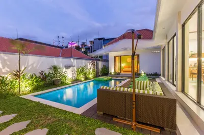 a swimming pool in the backyard of a house at VILLA BIBA cosy and stylish in Canggu