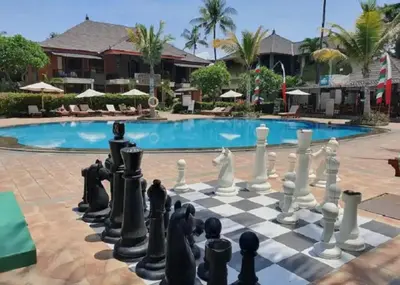 a chess board in front of a pool at Apartment at Jayakarta Residence Beach Front Access in Seminyak