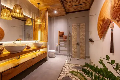 a bathroom with two sinks and a shower at Villa Sebelah by Optimum Bali Villas in Seminyak