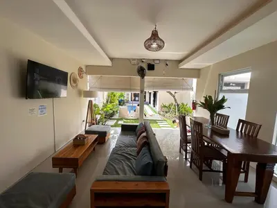 a living room with a couch and a table at Villa Majegau 3, 3 bedrooms, Seminyak center in Seminyak