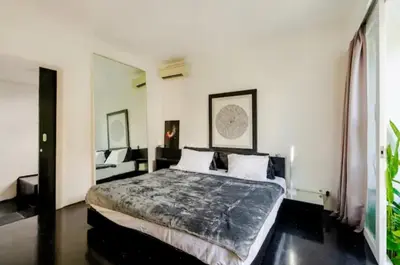 a bedroom with a large bed in a room at Villa with 2 Bedrooms & Private Bathrooms near to the beach Seminyak in Seminyak
