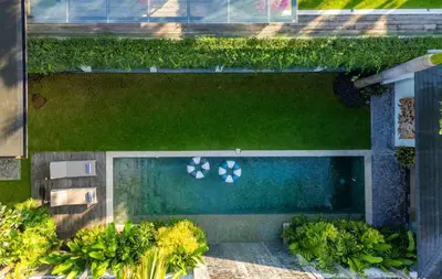 an overhead view of a swimming pool in a garden at Desa Berawa Beach Villa No13 in Canggu
