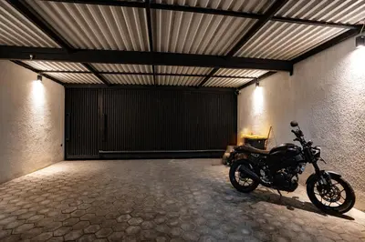 a motorcycle parked inside of a garage at Villa Maya in Kerobokan