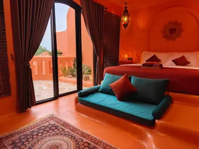a bedroom with a bed and a large window at Güzel Villa Bali in Badung