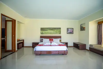 a bedroom with a large bed in a room at 1BR Private Pool Villa in Seminyak PB in Seminyak