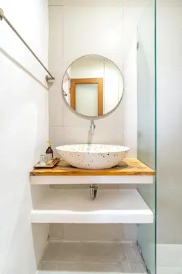 a bathroom with a sink and a mirror at Srikrisna in Seminyak