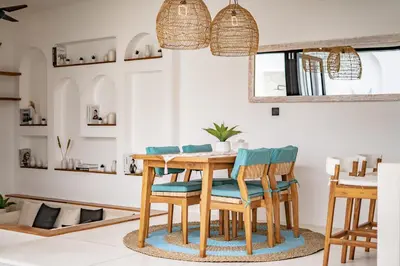 a dining room with a wooden table and chairs at Soft Opening! Villa Lumière 1 Seminyak in Seminyak