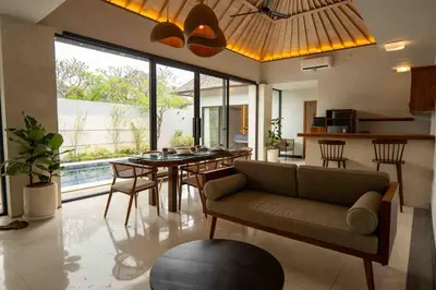 a living room with a couch and a table at Tuluscolivingseminyakvilla1 in Seminyak