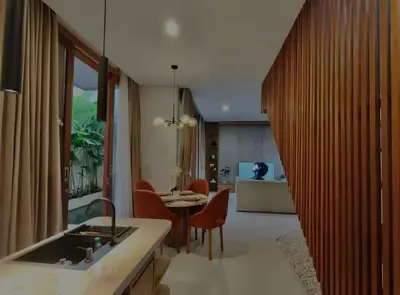 a kitchen and living room with a table and chairs at Villa Mirana in Seminyak