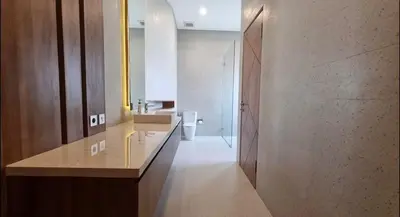 a bathroom with a sink and a toilet at Villa Mirana in Seminyak