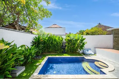 a swimming pool in the backyard of a house at Villa Litan Seminyak - 3 Bedroom Villa in Seminyak