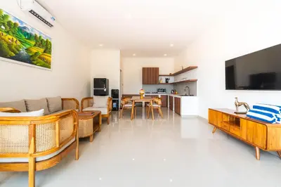 a living room with a couch and a table at Villa Litan Seminyak - 3 Bedroom Villa in Seminyak