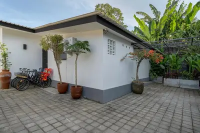 a group of bikes parked in front of a house at Incredible Family villa with water slide Beachside in Sanur