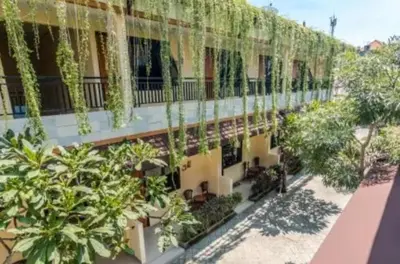 a building with plants on the side of it at Dewata ayu resident in Seminyak