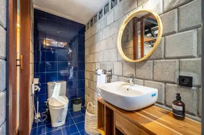 a bathroom with a sink and a mirror at First 5 Bedrooms Villa in Seminyak