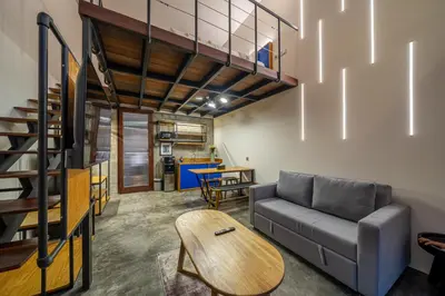a living room with a couch and a table at First 5 Bedrooms Villa in Seminyak