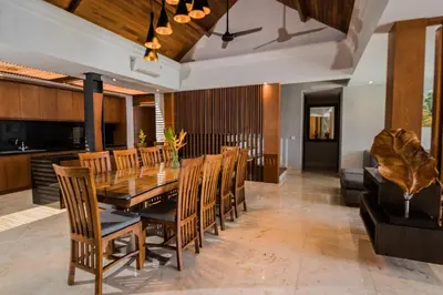 a dining room with a table and chairs at Villa By The Sea with private swimming pool in Benoa - Nusa Dua in Ujung