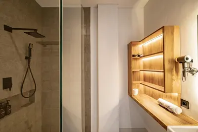 a bathroom with a shower and a sink at Aya Townhouses - Prime Location Umalas in Kerobokan