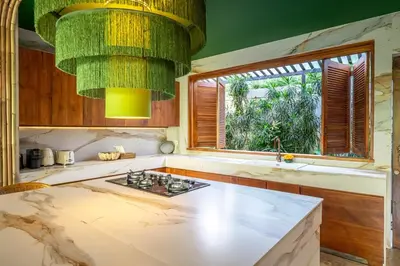 a kitchen with a sink and a large window at Sweet Surrender - Stylish 4BR Near Potato Head in Seminyak