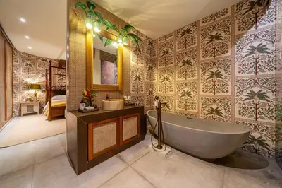 a bathroom with a tub and a sink at Sweet Surrender - Stylish 4BR Near Potato Head in Seminyak