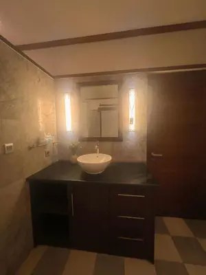 a bathroom with a sink and a mirror at Ohara Hideway 3BR Japanese Vibes Villa in Kerobokan Seminyak Bali in Seminyak