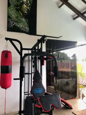 a room with a gym with a punching bag at Villa Denira, Home Gym & Private Pool in Nusa Dua