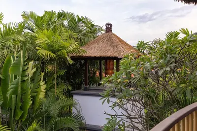 a gazebo in the middle of a garden at Aragreen Berawa Villa in Canggu