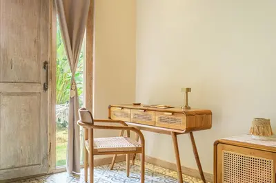 a desk and a chair in a room with a window at LePalms villa, 2min Beach, 10min Atlas,Finns Club in Canggu