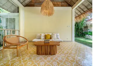 a living room with a couch and a table at LePalms villa, 2min Beach, 10min Atlas,Finns Club in Canggu