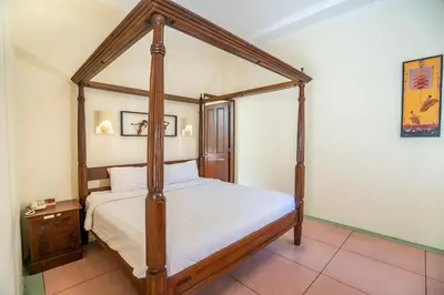 a bedroom with a four poster canopy bed at Villa PBC 2 Bed Room Private Pool in Seminyak in Seminyak