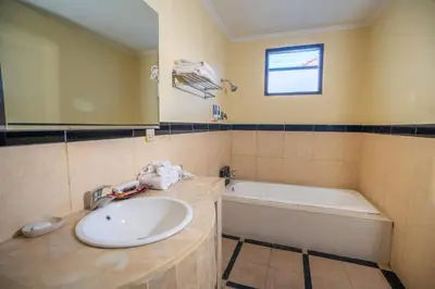 a bathroom with a sink and a bath tub at Clasic 3BRoom Villa In Seminyak in Seminyak